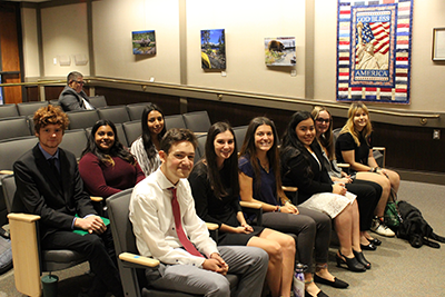 Students sit in the County Board of Supervisor's meeting